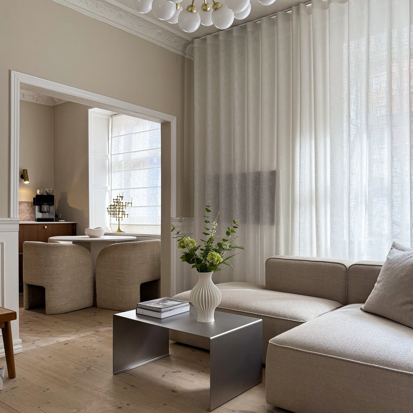 Angled composition showing the Elegance Coffee Table and more of the surrounding space.