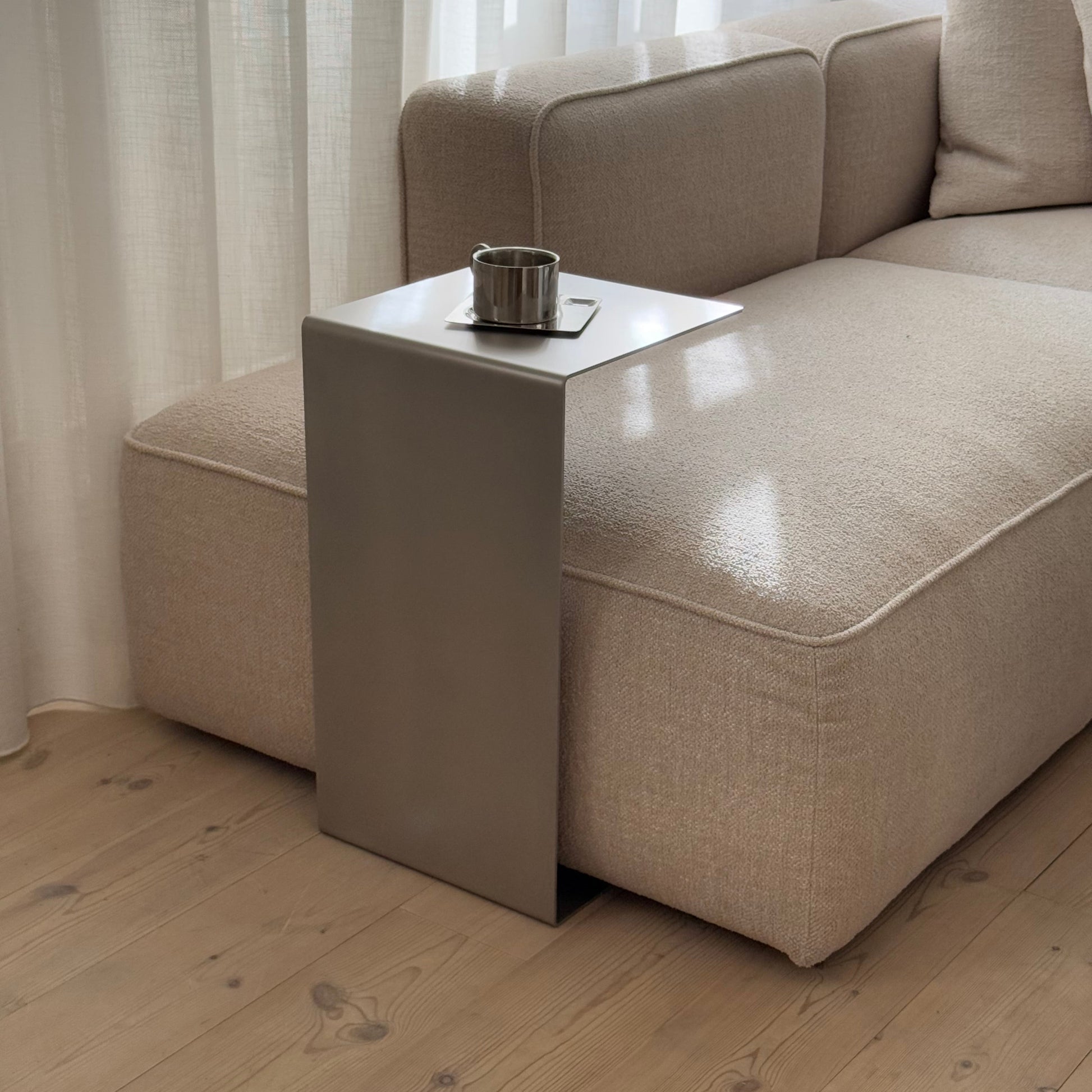 Side view of the Elegance Side Table revealing its minimal form and calm presence.
