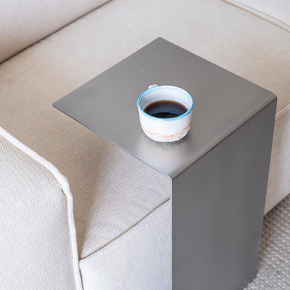 Top view of the Elegance Side Table in a new living room with coffee in a ceramic cup.